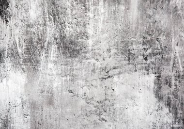 Yumuşak odaklı gri ve siyah duvar, arka planda çizikler var..