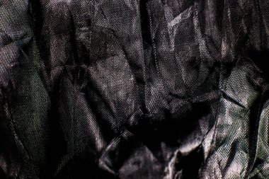 Siyah buruşuk pamuklu ağ örülmüş arka plan. Kapat..