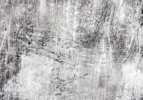 Yumuşak odaklı gri ve siyah duvar, arka planda çizikler var..