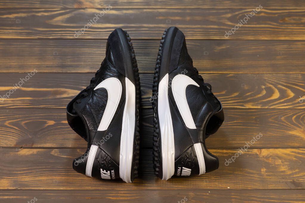 KYIV, UKRAINE - October 18, 2025 : Nike Premier III TF. Turf Low-Top Soccer Shoes. Black and white leather boots.