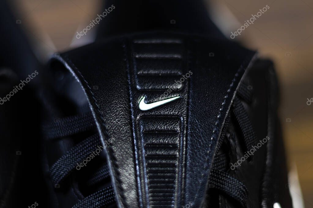 KYIV, UKRAINE - October 18, 2025 : Nike Premier III TF. Turf Low-Top Soccer Shoes. Black and white leather boots. Close up Nike company logo.