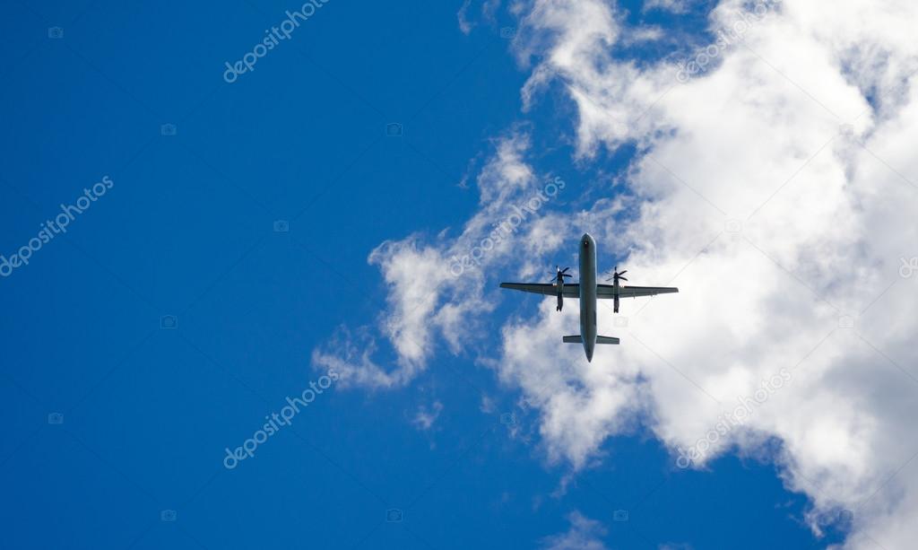 Blue sky fly-over.   Aircraft on a glide path to the airport in St John's Newfoundland, Canada.