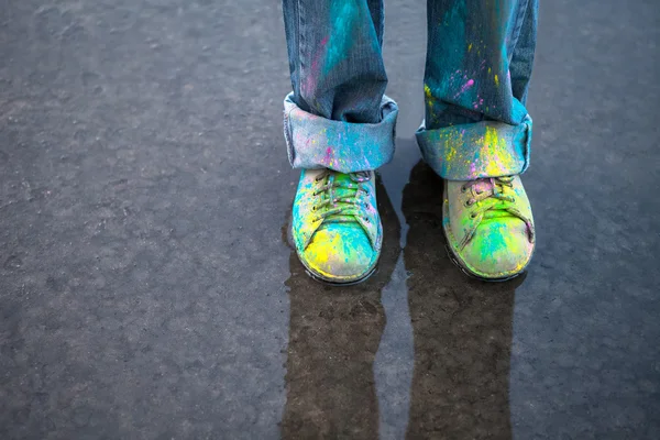 Colorful shoes on puddle — Stock Photo, Image