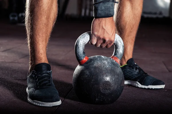 Crossfit kettlebell training in gym — Stock Photo, Image