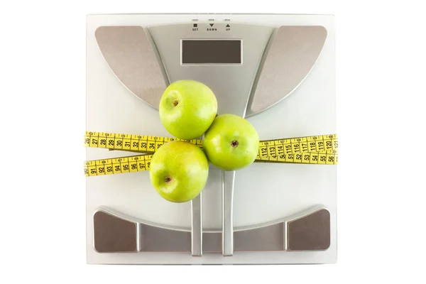 Měřítko s měřicí pásku a apple — Stock fotografie