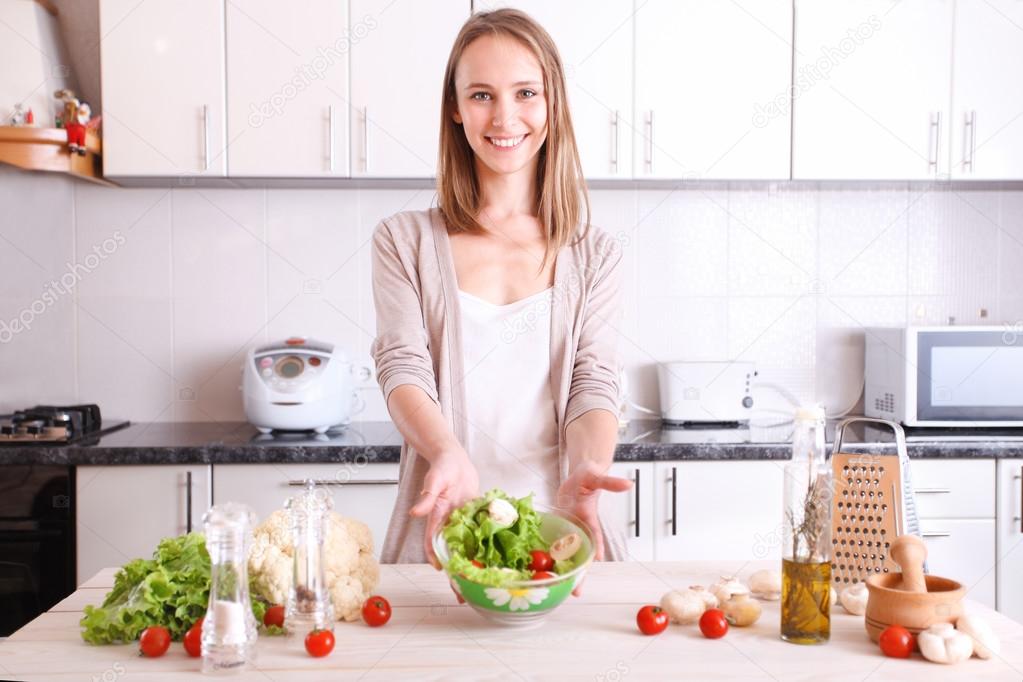 smiling woman making healthy food