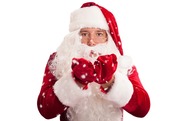 Weihnachtsmann in Brille pustet Schnee — Stockfoto