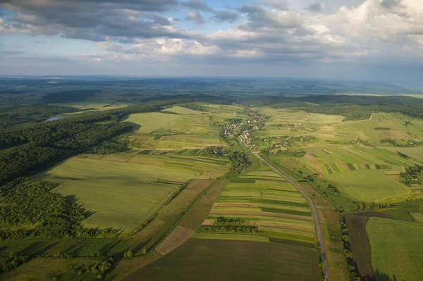 Aerial view on green and yellow parts of fields and countryside — Stock Photo, Image