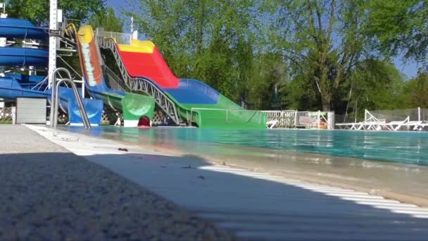 Colorful waterslides in water park — Stock Video