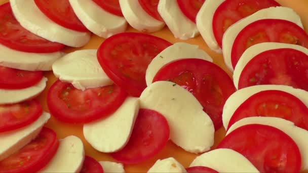 Tomato and mozzarella on a plate — Stock Video