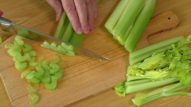 Fresh green celery on cutting board — Stock Video