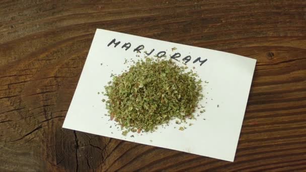 Marjoram on wood table — Stock Video