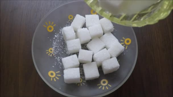 White sugar filled in a small square saucer — Stock Video