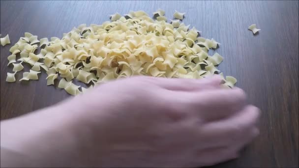 Raw pasta close seup on wooden background — стоковое видео
