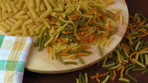 Different types of pasta on cutting board — Stock Video