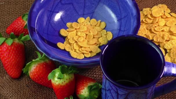 Healthy breakfast. Cornflakes, fresh strawberries and milk — Stock Video