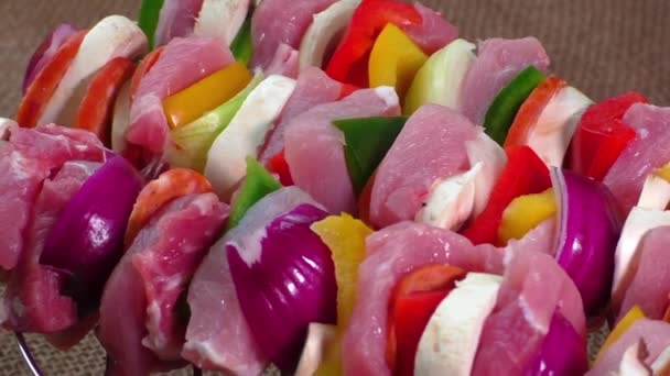 Raw pork skewers ready for grilling — Stock Video