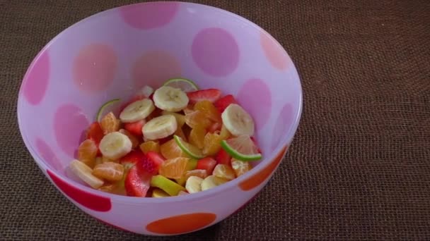 Bowl of healthy colorful fruit salad — Stock Video