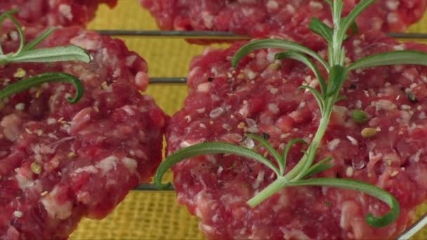 Raw minced hamburger meat with herb and spice prepared for grilling — Stock Video