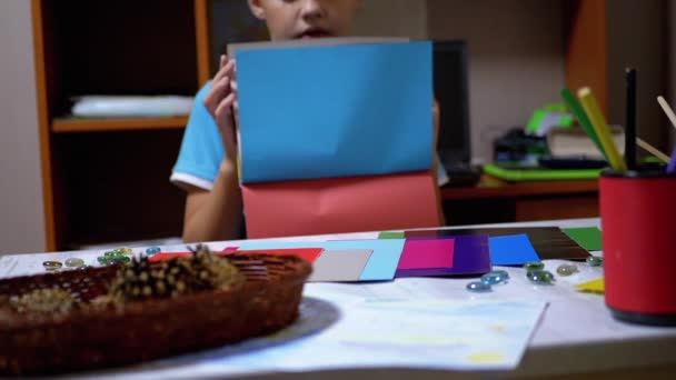 ( 영어 ) Serious Boy in Blue T-Shirt Raises Hands and Shows Blue on Colored Paper — 비디오