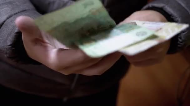 Child in a Jacket Holds and Counts Hryvnia Banconote, Money in Hands. Primo piano — Video Stock