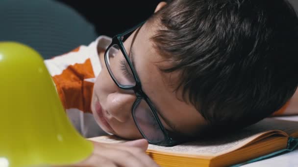 Inquisitive Boy with Glasses Fell Asleep on Book Read on Table. Fatigue, Sleep — Stock Video