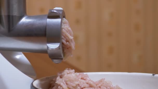 Electric Meat Grinder Scrolls Raw Chicken Fillet for Minced Meat through a Sieve — Stock Video