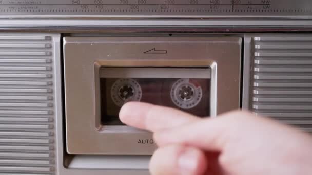 Woman Points Finger Transparent Vintage Cassette Tape Inside Tape Recorder. 4K — Vídeos de Stock