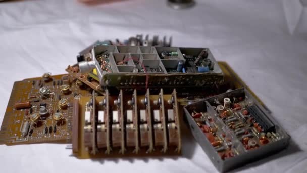 Male Hand Throws on Table Old Printed Circuit Boards, Microcircuits, Radio Parts — Stock Video