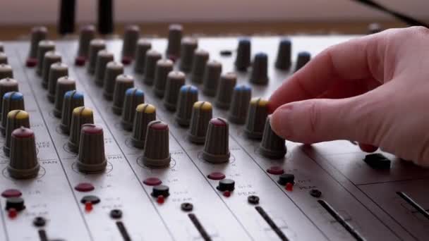 Hangmérnök, DJ Moves Sliders with Fingers on Audio Mixer in Recording Studio — Stock videók