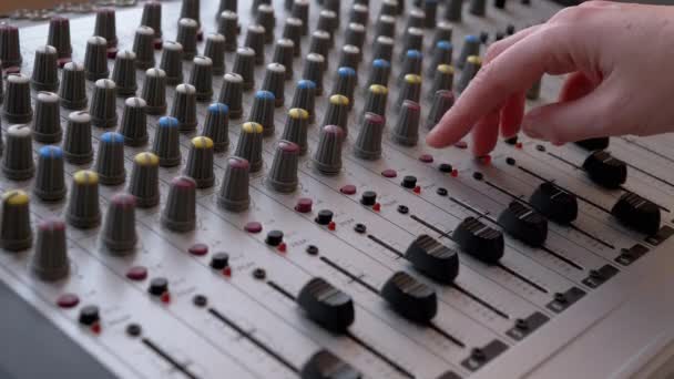 Hangmérnök, DJ Moves Sliders with Fingers on Audio Mixer in Recording Studio