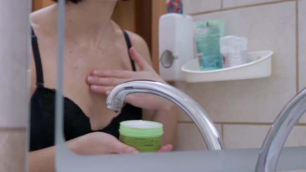 2016 년 2 월 9 일에 확인 함 . Woman in Underwear, Bra, Moisturizing Cream to Skin of Breasts in Bathroom. 4K — 비디오