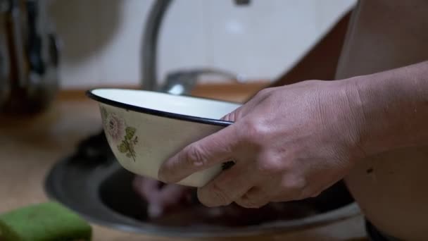 Man Holding a Bowl in Arms and Clears Blockage in the Dirty Sink. 4K — Video Stock