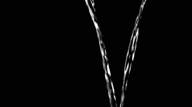 Two Streams of Water with Drops Pour into Empty Space. Black background. A transparent stream of water with streams joins into a funnel. Splashes, drops. Abstraction, texture, lighting. Slow motion.