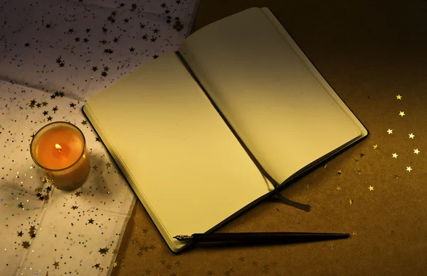 Vintage notebook with a   candle — Stock Photo, Image