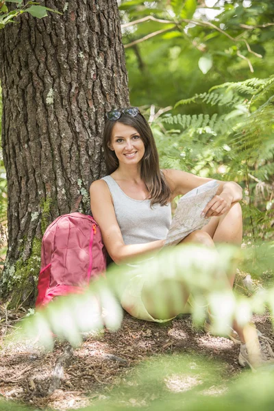 Young backpacker with map — Stock Photo, Image