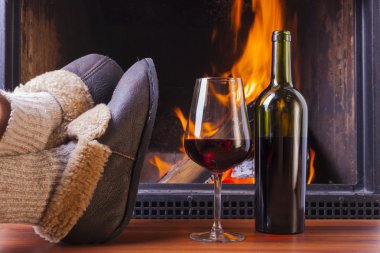 relaxing with drinks at fireplace clipart