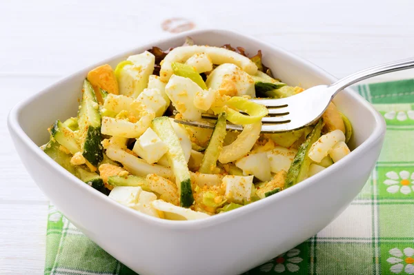 Salad with squid, cucumbers and eggs. — Stock Photo, Image