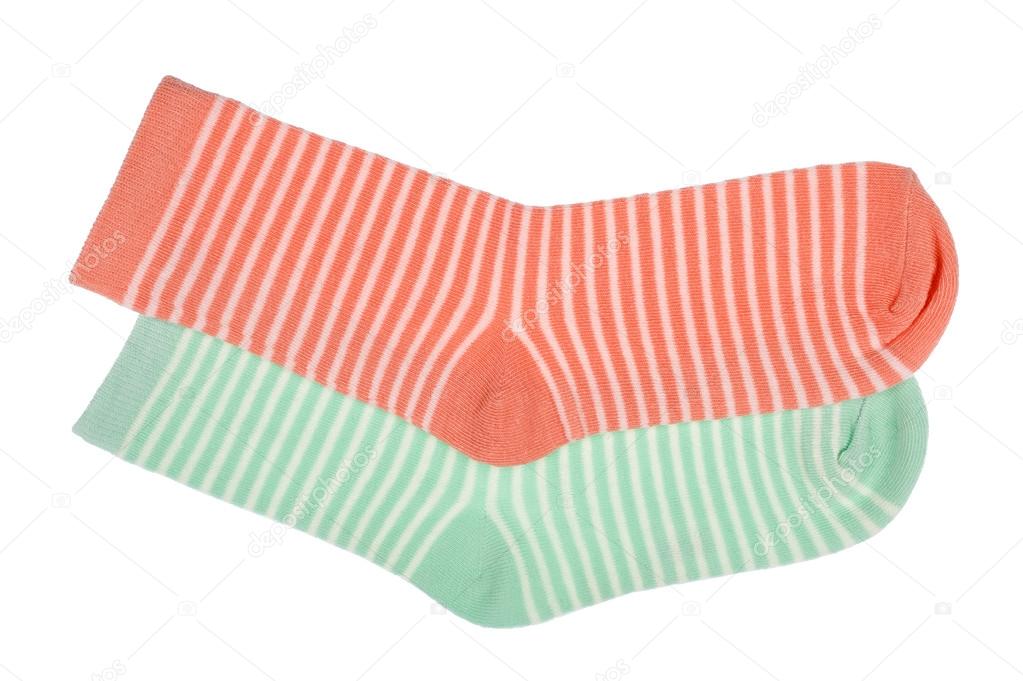 Pink and green striped childish socks isolated.