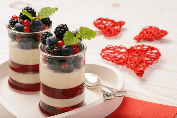 Layered berry dessert - panna cotta with berry jelly, blueberries,blackberries and red currants. — Stock Photo, Image