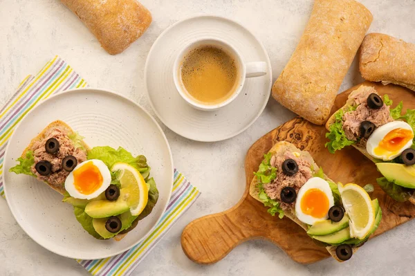Tuna, eggs, olives  and avocado sandwiches