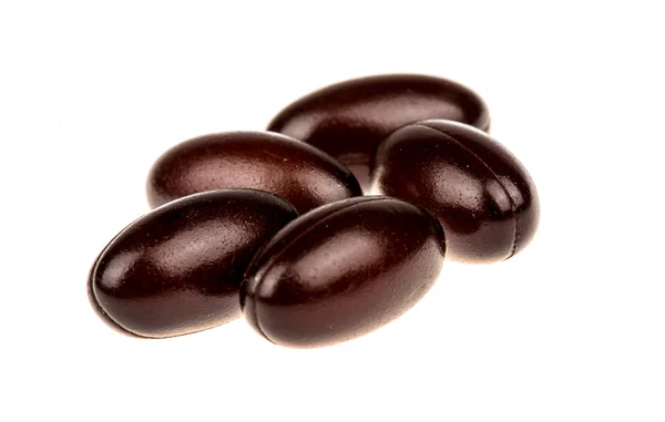 İzole kahverengi softgels.