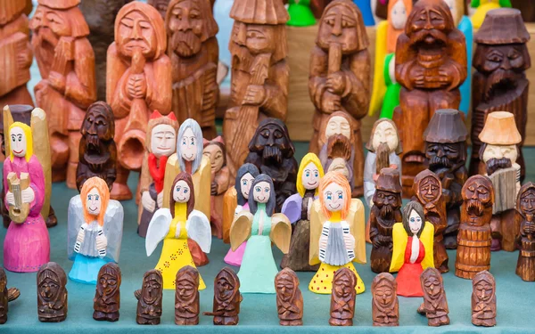 The variety of wooden souvenir figurines.