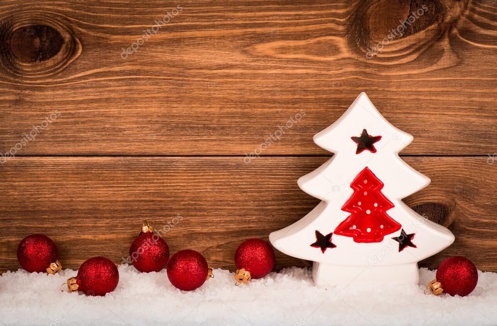 Christmas Decorative Ceramic Tree With Red Balls On The Snowed