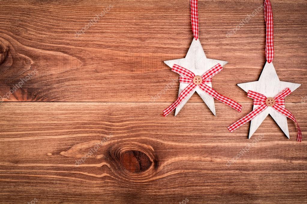 Christmas Decorative Wooden Stars On The Wooden Background