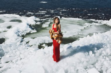 woman posing in dress at winter time