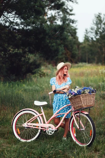 Beautiful girl with ladies bicycle — Stock Photo, Image