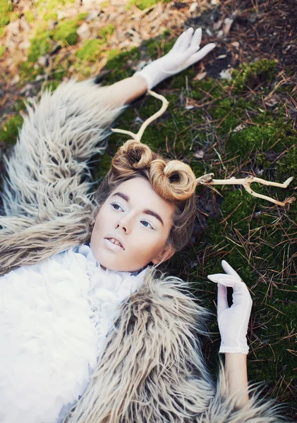 Woman with tree branches in hair — Stock Photo, Image