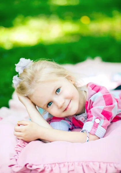 Girl lying on coverlet — Stock Photo, Image