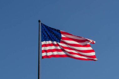A Flag of the United States waving in the wind